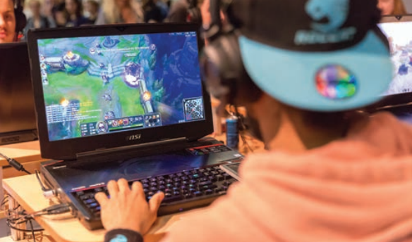 A Visitor Playing League of Legends at an eSports Exhibition (flickr.com)