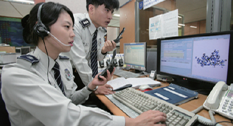 A Police Officer Receiving a Case Submission (gokmu.com)
