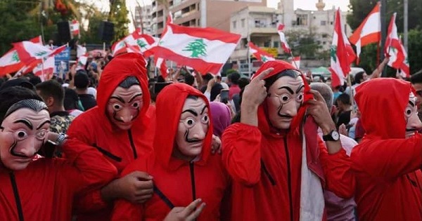 Protestors Wearing Iconic Red Jumpsuits and Dali Masks (meaww.com)