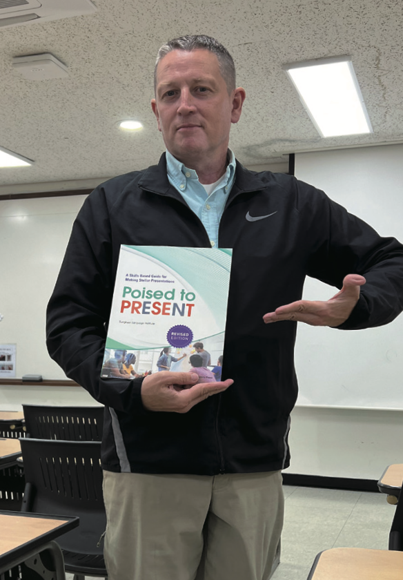 Professor Thomas with the English Presentation Textbook